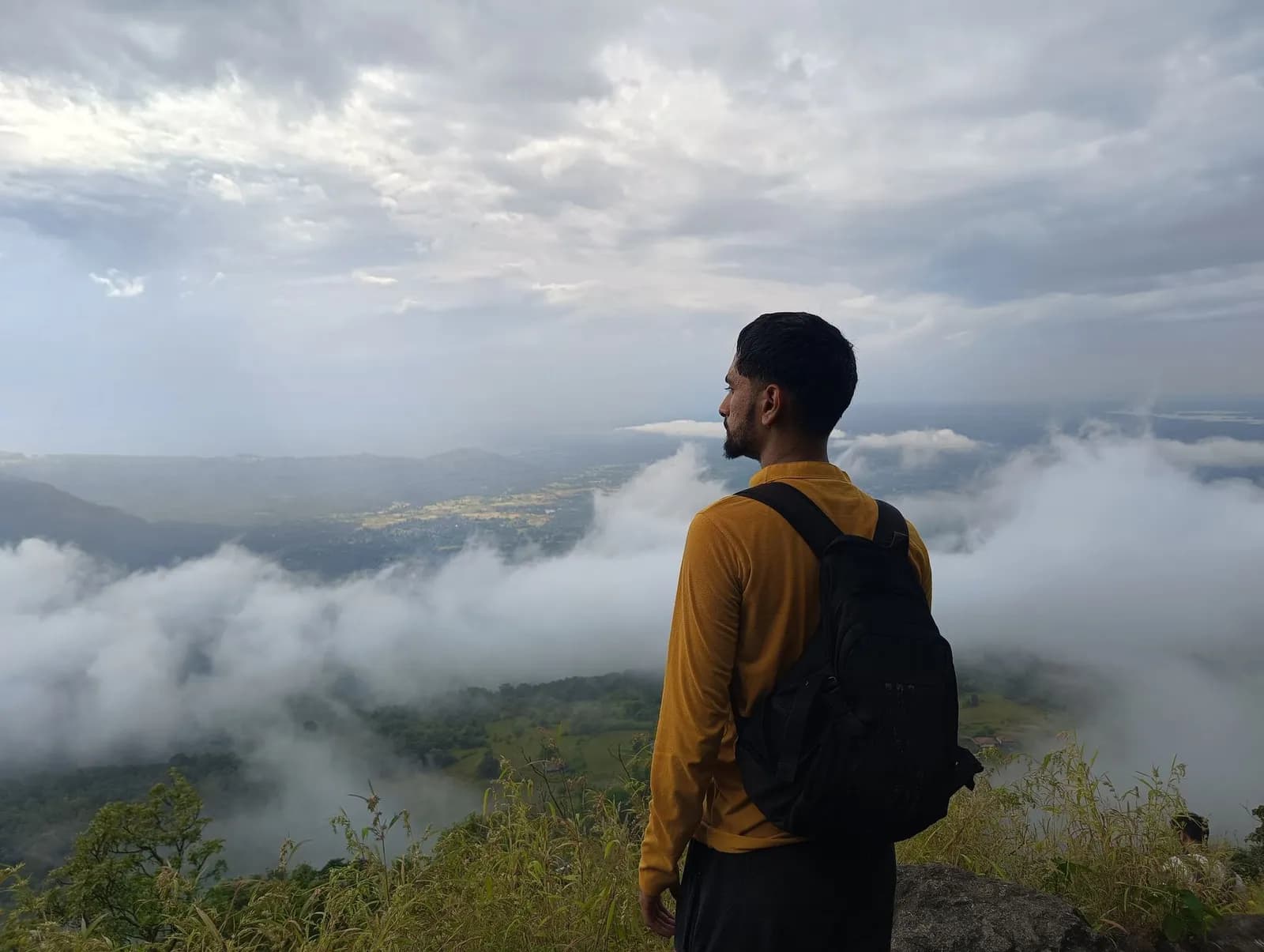 A traveller above the clouds on a Western Ghats trek